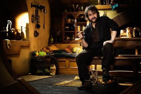 Peter Jackson sitting in Bilbo's pantry Peter Jackson Director, Peter Jackson, Ian Mckellen, Movie Directors, Bilbo Baggins, Hobbit Hole, An Unexpected Journey, Hobbit House, Aidan Turner