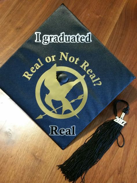 Hunger Games graduation cap designed by Melanie and Andrea. Hunger Games Grad Cap, Hunger Games Graduation Cap, Twilight Graduation Cap, Real Or Not Real, Creative Graduation Caps, Graduation Cap Decoration Diy, High School Graduation Cap, College Graduation Cap Decoration, Grad Cap Designs