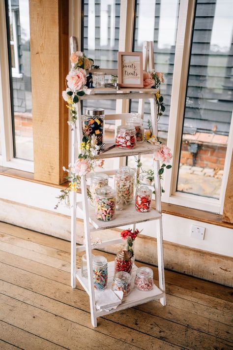 a white ladder with sweets in jars for DIY wedding decor at vault manor wedding in essex Candy Ladder Display, Diy Sweet Table Wedding, Diy Sweet Cart Wedding, Diy Wedding Candy Bar, Sweet Trolley Ideas, Wedding Sweet Station, Sweet Cart Diy, Pick And Mix Wedding, Sweet Station Wedding