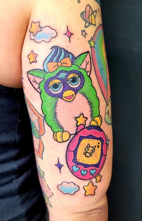 90s tattoos 90s kid Furby Tomagotchi Lisa Frank color scheme Retro Throwback 90s Sleeve Tattoo, Lisa Frank Style Tattoo, 90s Aesthetic Tattoos, Furby Tattoo Design, 90s Tattoo Sleeve, 90s Theme Tattoo, 90s Nostalgia Tattoo, Lisa Frank Tattoo Ideas, 90s Cartoon Tattoos Sleeve