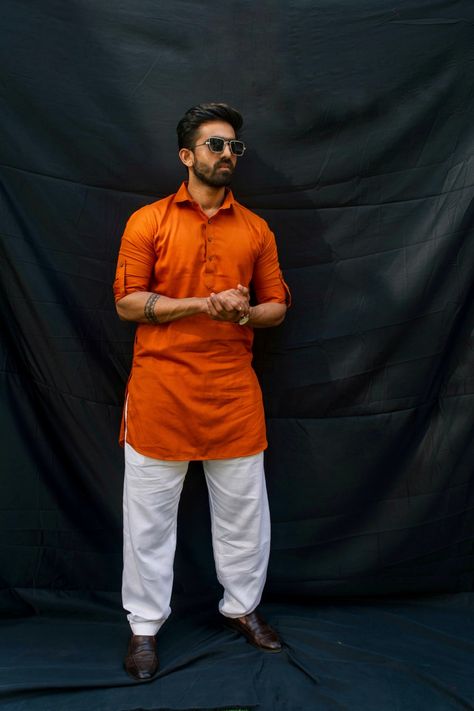 Orange Kurta, folded sleeves and look muscular !!Fashion couture, indian couture, indian wear, indian wedding, ethnic wear for men, indian, traditional dresses, wedding wear, party wear, wedding dresses for men, ethnic wear for men, wedding suits for men, Manyavar, indian wedding dresses for men, latest wedding dresses for men, men ethnic wear, latest men ethnic wear. Orange Kurta For Men, Traditional Dresses Wedding, Muscular Fashion, Haldi Board, Orange Indian Outfit, Party Wear Wedding Dresses, Men Ethnic Wear, Kurta Designs Men's, Orange Dress Wedding