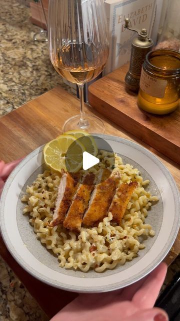 Kristen Faith on Instagram: "Ingredients 
12 oz pasta of your choosing 
2 chicken breasts sliced into cutlets 
5 garlic cloves minced 
1 shallot minced 
4 basil leaves thinly sliced 
4 Tbsp butter 
1-2 Tbsp olive oil (to coat the pan) 
1 lemon juiced and zested 
1/3 C Parmesan 
1 1/4 C heavy cream 
30 turns of cracked pepper 
Salt to taste 

Chicken cutlets 
Canola/vegetable oil 
2 eggs 
1/2 C flour 
1/4 C panko breadcrumbs 
1/2 Italian bread crumbs 
Sprinkle of Parmesan cheese 
Salt and pepper 

Directions 
Boil a pot of salted water. 
Mix breadcrumbs, Parmesan and seasonings. 
Dip the cutlets in flour, egg and then bread crumbs 

In a shallow pan heat up oil and fry cutlets until cooked through and golden brown 

Assemble the sauce 
Add oil and butter, once melted add in cloves of garlic Basil Leaves, Cracked Pepper, Italian Bread, Chicken Cutlets, Shallots, Bread Crumbs, Chicken Breast, Garlic Cloves, Basil