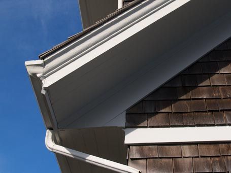 This photo depicts an extended, closed eave with a level soffit that transitions at the end-wall into an extended, closed rake that follows the roof slope. Rafter Framing, Roof Soffits, Siding Detail, Small Cabin, Cabin Design, Riddles, Moldings And Trim, Beck, Curb Appeal