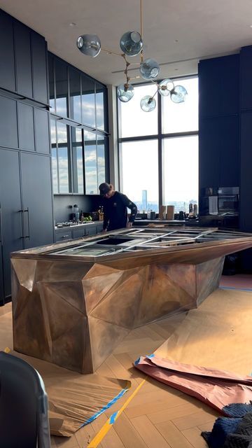 KJ Remodeling of NY on Instagram: "✨JUST INSTALLED ✨this incredible custom 3D shaped bronze island structure in our client’s new NYC Penthouse. This absolutely spectacular kitchen island design slowly comes to life. Have you ever see anything like this? Drop a comment below 👇😀👀🔥 Design: @builtinstudio GC: @kjremodeling 👉 Follow to see the progress! 😃 #kitchendesign #kitchendecor #kitchenisland #kitchengoals #kitchenremodel #kitcheninspiration #kitcheninspo #kitchenset #kitchenstyle #kitchenideas #kitcheninterior #kitchentrends #nyccontractor #nycgc #nycremodeling #generalcontractor #interiordesign #interiordesigner #nycinteriordecor #nycinteriorstyle #nycinteriordesigners #nycarchitect #nycarchitecture #nycapartments #nycrealestate #interiordecor #homedecor #homedesign #luxuryhomes # Sculptural Kitchen Island, Nyc Penthouse Kitchen, Range In Island, High Tech Kitchen, Penthouse Kitchen, Montana House, Nyc Penthouse, Bronze Kitchen, Nyc Real Estate