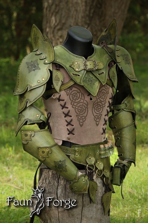 Green Leather Costume Set  www.Faun-Forge.com Set contains: -Gorget + two Pauldrons with wings -Alchemy belt -Pair of bracers with paws -Set of leafy hangers -Vest Optional items -Bandolier -Bandolier+backscabbard You can ask for custom vest ornaments, no real limitation there. www.faun-forge.com Pauldrons has position adjustment, to front and rear. And are assembled to the removeable gorget. Shoulders consist of four moveable parts giving you more freedom moveing arms to the front and up. Set h Green Leather Armor, Buck Skin Clothing, D&d Costumes, Clothes For Wings, Dnd Leather Armor Female Druid, Fairy Larp Costume, Male Rennisance Faire Costumes, Druid Ren Faire, Forest Fae Costume