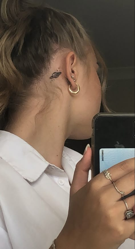 Planet Tattoos Behind Ear, Planet Behind Ear Tattoo, Saturn Tattoo Behind Ear, Moon And Saturn Fine Line Tattoo, Saturn Stick And Poke, Small Snake Tattoo Placement, Saturn Tiny Tattoo, Behind The Ear Tattoo Ideas, Lil Tattoos