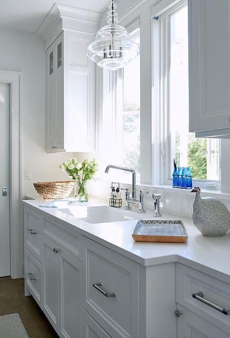 Chandelier Over Kitchen Sink, Gray Subway Tile Backsplash, White Marble Backsplash, Over Kitchen Sink, Light Grey Kitchen Cabinets, Clear Glass Chandelier, Light Grey Kitchens, Black Granite Countertops, White Subway Tile Backsplash