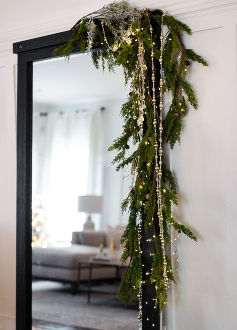 Craftberry Bush | Cozy Christmas Tour Part 2 | https://www.craftberrybush.com White Brick House Christmas Decor, Christmas Garland Bedroom, Christmas Garland Ideas Hallway, Garland Christmas Ideas, How To Hang Candles From Ceiling, Hanging Light Christmas Decor, Christmas Trellis Outdoor, No Mantel Christmas Decor, Wreaths On Staircase