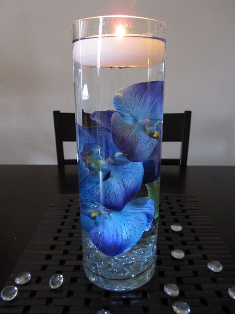 Floating Candle Centerpieces Blue, Purple Floating Candles, Blue Floating Candles, Glass Wedding Centerpieces, Floating Candle Centerpieces Wedding, Floating Candles Wedding, Blue Wedding Centerpieces, Wedding Vase Centerpieces, Floating Candle Centerpieces