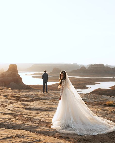 moments from a cliffside sunrise in Lake Powell Booking this location for 2025 & I cannot wait for all of the adventures to this sacred spot #amangiriwedding #amangiriphotographer #amangirielopement #amangiriresort #amangiriengagement #lakepowellweddingphotographer #utahweddingphotographer #zionweddingphotographer #yosemiteweddingphotographer #grandtetonweddingphotographer #kanabweddingphotographer #phoenixweddingphotographer Amangiri Resort, Dramatic Veil, Elegant Wedding Gown, Utah Adventures, Modest Wedding Gowns, Yosemite Wedding, In The Middle Of Nowhere, Elopement Photos, Adventure Photographer