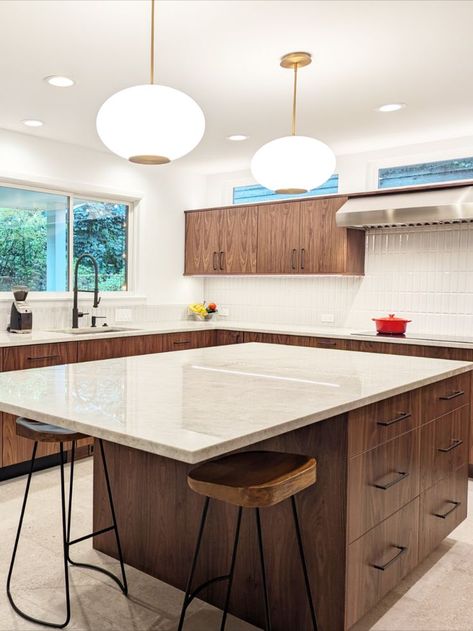 White kitchen island countertop with large overhang, wooden cabinetry, transom window above range and nearby cabinetry Windows Above Kitchen Cabinets, Window In Kitchen, Horizontal Windows, Chicago Metro, Dark Kitchens, Painted Kitchens, Real Kitchens, What Is Design, Transom Window