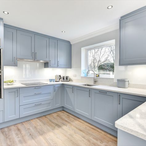 A classic blue finish has been chosen for this project, to combine nicely with sparkling white work surfaces, which are illuminated by undercabinet downlights. 

Horsham Showroom: 01403 721086 I Worthing Showroom: 01903 522555 I Website: https://alexanderkitchens.co.uk/. Conservatory Style Kitchens, Small Kitchen Uk Ideas, Hamptons Blue Kitchen, Light Blue Small Kitchen, Baby Blue Kitchen Ideas, Light Blue Shaker Kitchen, Pale Blue Kitchen Ideas, Blue Kitchen Design Ideas, Light Colour Kitchen