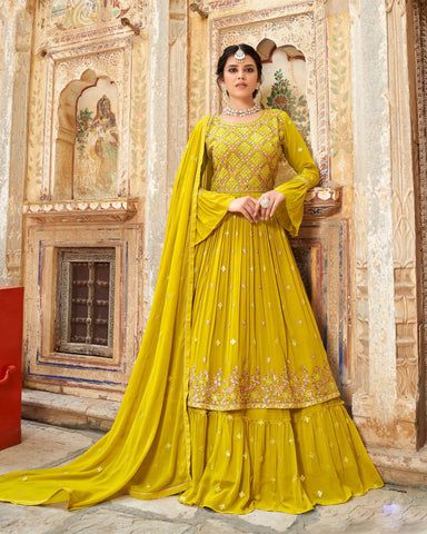 Color- Yellow Fabric- Georgette Work- Thread, Sequins Frock style anarkali kameez in yellow color comes with naira cut/side slits and thread and sequins work embroidery all over the front panel. This beautiful anarkali is fabricated in georgette fabric for flowy look. Bottom in lehenga style comes in georgette fabric. Dupatta in georgette fabric enhanced with thread and sequins work embroidery. Long Salwar, Indo Western Lehenga, Long Choli Lehenga, Yellow Dupatta, Bottom Heavy, Modest Evening Dress, Georgette Lehenga, Yellow Lehenga, Georgette Dupatta