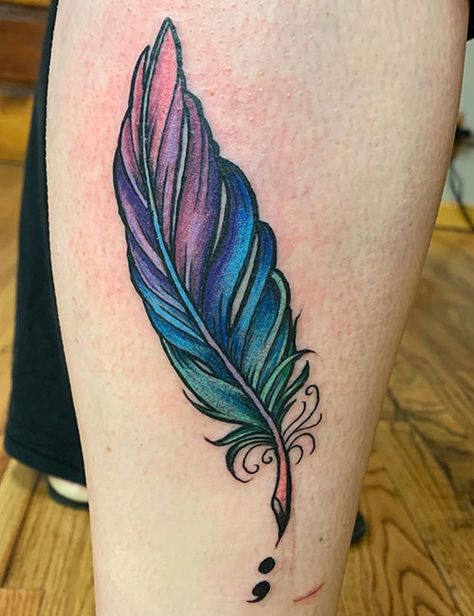 31 Simple Yet Striking Tattoos And What They Mean Colour Tatoos Men, Sneak Tattoo Design, Color Feather Tattoo, Feather Tattoo Design For Women, Blue Feather Tattoo, Colorful Feather Tattoo, Feather Tattoo Chest, Neon Tattoos, Feather Tattoo For Men