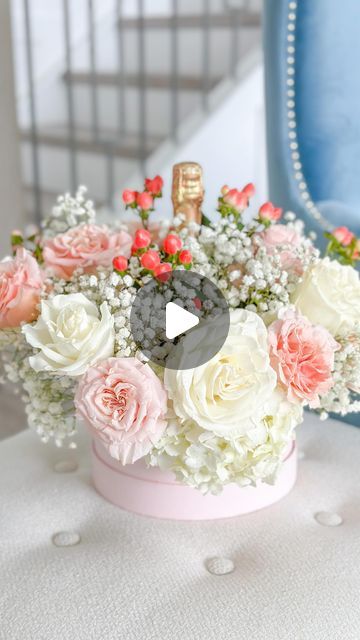 Stephanie Veltri on Instagram: "A wonderful Valentines gift that you can diy is a cute round box that comes with floral foam featuring your favorite bottle of champagne, sparkling wine, Prosecco or a nice bottle of wine. Here’s what you will need for this lovely DIY: -1 bunch of white garden roses -1 bunch of light pink garden roses -1 bunch of pink Saint John’s Wort -1 bunch of baby’s breath -1 bunch of white hydrangea stems -1 round box that comes with floral foam (this one is linked in my Liketoknowit, stories for 24 hours or my pink round LTK4 highlight) -Plastic wrap or clear gift wrap *Tip 📋💗 Let the floral foam soak until it is fully filled with water. I love that the box comes in multiple colors and includes the floral foam, so you’re all ready to create! Happy DIYing!💙 Champagne Bottle Floral Arrangement, Wine Gift Box Ideas, White Garden Roses, Round Gift Boxes, Bottle Of Champagne, Floral Arranging, Flower Box Gift, Valentines Crafts, Wine Gift Boxes