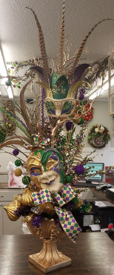 Mardi Gras silk arrangement. Harlequin ribbon. Masks. Purple, green, gold. Custom made by Master Designer, Nichole Lefebvre,  Louisiana. Mardi Gras Arrangements, Mardi Gras Valentines Party, Mardi Gras Floral Arrangements, Mardi Gras Flower Arrangements, Mardi Gras Flowers, Mardi Grad, Mardi Gras Ball, Mardi Gras Wedding, Floral Design Business