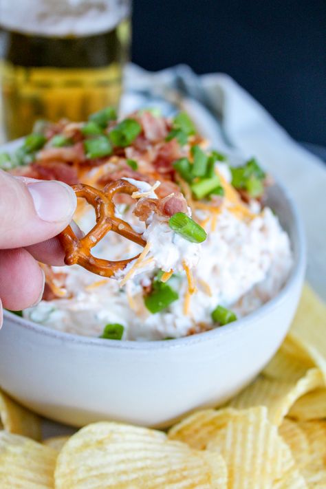 Loaded Beer Dip takes game day snacking to the next level. Creamy beer dip mixed with sharp cheddar, smokey bacon, and fresh green onion. This is a dip you can't miss! #beerdip #beer #diprecipes #gamedayrecipe #tailgatingrecipes #footballrecipes #cheese Beer Dip, Dips Appetizers, Cheddar Dip, Beer Ingredients, Cold Dips, Beer Bacon, Bacon Dip, Tailgating Recipes, Beer Bread