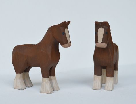 "A pair of Hand carved wooden Clydesdale Horse made from bass wood, hand painted with acrylic paints. Measurements are approximately 3\" inches long, 1\" wide and 3 1/4\" high *Animals are sold by the pair. Message me if you would like to purchase just one, I would be happy to set up a custom listing for you. Mo and Kelly Dallas have been making a living producing Hand Carved wooden Noah's Arks, Angels & other folk art in our home studio in rural Ohio for over 20 years. All of our products are h Hand Carved Wooden Toys, Whittled Animals, Wooden Animals Patterns, Easy Whittling Projects, Horse Wood Carving, Wooden Diy Crafts, Whittling Patterns, Art Sculpture En Bois, Clydesdale Horse