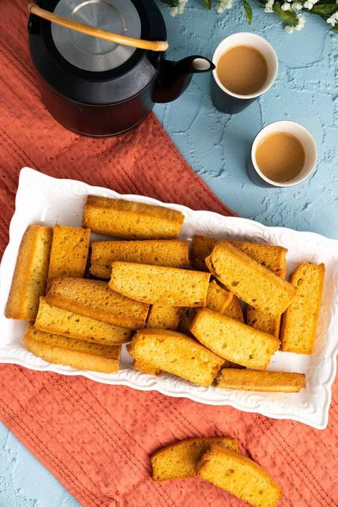 This tea-time snack is very popular in Pakistan and India. Once you bake cake rusk at home, you will never buy them from the store. Today, I am going to share a unique recipe from my homeland, Pakistan. It is the recipe of the famous cake-rusks made at local bakeries. These are served as the favorite tea time snack and everyone enjoys it with a hot cup of tea. These are crunchy and crispy cookies just like the Italian biscotti. Chai is something masses in Pakistan and India take very… Cake Rusk Recipe, Rusk Recipe, Pecan Coffee Cake, Plain Cake, Sour Cream Pound Cake, Store Bought Cake, Vanilla Sponge Cake, Bake Cake, Biscotti Recipe