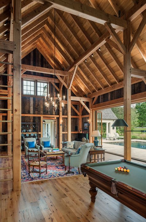 Archer & Buchanan Architecture | Heavy timber framed party barn with large folding doors opening up to pool and patio with bar, billiards, game area and sitting area. #timberframe #partybarn #poolhouse #worthingtonshagenbuilders #tammyconnorinteriordesign #tomcranephotography Barn Pool House, Barn Pool, House Mediterranean, Pool House Plans, Party Barn, Interior Design Photography, Beautiful House Plans, Inviting Home, Barn House Plans