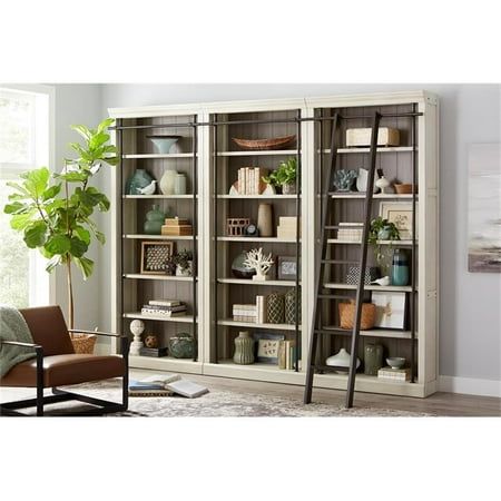 Reminiscent of a quaint French library, the Toulouse collection with its ringed steel frame, aged white and warm gray finishes will transform any office or home into an elegant chateau. The white wood bookcase wall has five adjustable shelves for cherished memories and collectibles, ringed steel frame for an elegant look, hand applied multi-step finish that enhances the natural grain and beauty of the wood, is sized to fit perfectly in 8 foot ceilings and requires minor assembly. Features: Five Wall Of Bookshelves Living Room, Book Case Bedroom Ideas, Home Library Room, Cozy Library Room, White Wood Bookcase, Library Room Design, Bookshelves Living Room, French Library, Large Wall Shelves