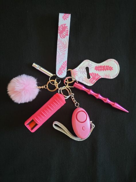 The Pink Floral Keychain Bundle comes with a wristlet, chapstick holder, Kubaton stick, safety alarm/flashlight, pepper spray, pompom, and safety emergency whistle. Kubaton Stick, Pink Flashlight, Emergency Whistle, Keychain Bundle, Floral Keychain, Safety Keychain, Safety Alarm, Chapstick Holder, Cute Pink