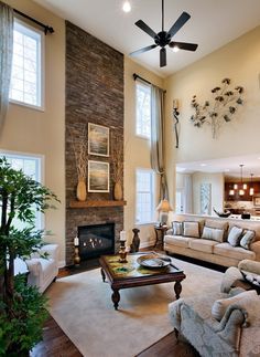 Two story great room windows & fireplace...would not have the half wall separating the great room from the kitchen though Tall Fireplace, High Ceiling Living Room, Toll Brothers, Foyer Decorating, Family Room Design, Fireplace Design, A Living Room, Fireplace Decor, Stone Fireplace