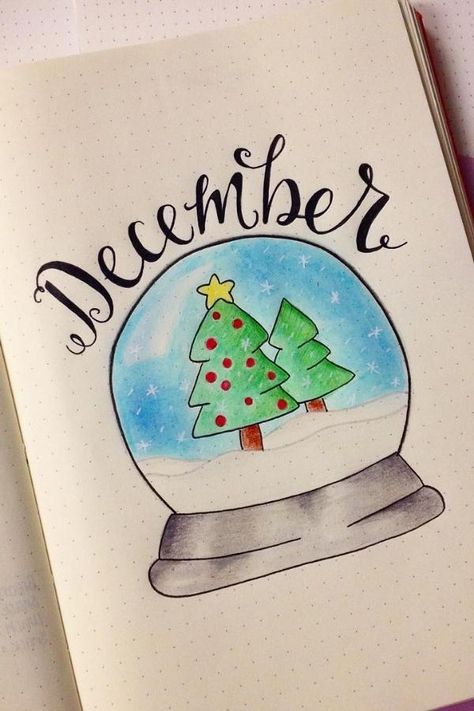 We all desire to have some magic in our lives. Christmas is a time of year when we all hope for some Christmas magic to happen. One way to bring the Christmas magic into your bullet journal is by creating a snow globe cover page. #ChristmasBujoCoverPage #BujoCovers #Christmas Snow Bullet Journal, New Year Cover Page, Christmas Bujo Ideas, Christmas Bullet Journal Cover, Bullet Journal Ideas Christmas, Year Cover Page, Journal Ideas Christmas, Bullet Journal New Year, December Bullet Journal Ideas