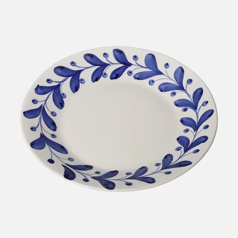 Inspired by intricate olive decorations found on antique Greek ceramics, Anna boasts a painterly motif that is simplistic yet quietly impactful. Handpainted in Portugal by artisans, this lively plate is the perfect entree into decorative tableware. Founded by textile designer Carolina Irving and her two daughters, the eponymous brand collaborates with artisans across the globe to curate ceramics with rich stories. Due to the handmade nature of this piece, slight variations may occur. Olive Decoration, Greek Ceramics, Olive Decor, Carolina Irving, Olive Dishes, Simplistic Style, Greek Pottery, Diy Ceramic, Greek Dishes