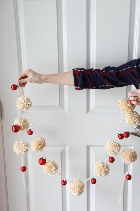 A fast one-hour garland made from yarn pom-poms & mini-ornaments. Use it to decorate a mantel, ledge, or window for less than $10! Diy Pom Pom Garland, Garland For Christmas Tree, Diy Yarn Pom Pom, Garland For Christmas, Fun Winter Crafts, Christmas Pom Pom, Diy Girlande, Diy Christmas Garland, Christmas Yarn