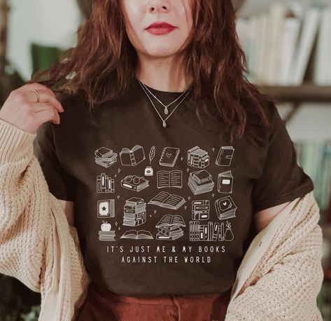 It's Just Me & My Books Against the World Shirt ❁ A B O U T ❁ O U R ❁ S H I R T S ❁ ✧ 100% Cotton ✧ Wash (inside out) and dry normally (on cool for best results) ❁ S I Z I N G ❁ ✧ All of our t-shirts are unisex sizing, so they run slightly larger than typical women's shirts and slightly smaller than typical men's shirts. ✧ Most women find their typical size works best for a loose fit ✧ For an oversized look, size up Size guide and fit ------------------------------S------M------L------XL Width o Book Worm Gifts, Reading Tshirt, Library Shirt, Book Club Gifts, Literary Shirts, Gifts Book, Book Merch, Bookish Merch, Bookclub Gifts