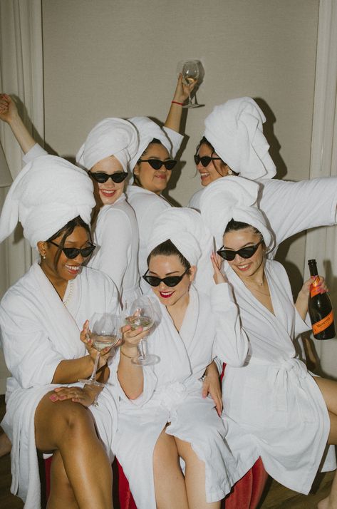 A group of girls drinking champagne in white robes Bachelorette Birthday Party Ideas, Robe And Towel Photoshoot, Bach Group Outfits, Hen Do Photo Ideas, Hotel Getting Ready Photos, Spa Hen Do, Party Photoshoot Aesthetic, Vintage Hotel Photoshoot, Glitz And Glam Bach