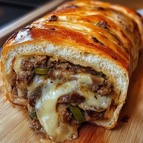 Who can resist this melty, beefy, and cheesy Philly Cheesesteak Stromboli? Get ready to take your taste buds on a ride! 🧀🚀 📋 Ingredients:  - 1 lb (450g) ground beef  - 1 tablespoon olive oil - 1 medium onion, chopped - 1 green bell pepper, chopped - 1 cup sliced mushrooms  - 1 teaspoon garlic powder - Salt and pepper to taste - 1 cup provolone cheese, shredded - 1 cup mozzarella cheese, shredded - 1 package of pre-made pizza dough (about 1 lb) - 1 egg, beaten (for egg wash)  #Stromboli Steak Stromboli, Cheesesteak Stromboli, Sweet Chili Sauce Recipe, Cheesesteak Stuffed Peppers, Stromboli Recipe, Stuffed Bread, Best Crockpot Recipes, Chicken Breakfast, Crockpot Breakfast