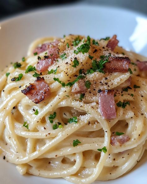 "Everyone in my family can’t get enough of this Spaghetti Carbonara! It’s creamy, dreamy, and the perfect comfort food. 🤍   Ingredients: - Spaghetti - Eggs - Parmesan cheese  For the rest of the ingredients and full instructions, check the link in the first comment [👇] [👇].  #SpaghettiCarbonara #PastaLovers #ComfortFood #Yummy #CookingAtHome" Spaghetti Carbonara Creamy, Spaghetti Parmesan, Everyone In My Family, Creamy Spaghetti, Pasta Carbonara, Carbonara Pasta, Clean Plates, Spaghetti Carbonara, Food Ingredients