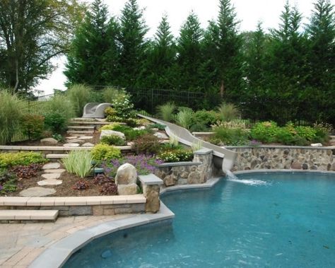 Pool Slide Landscaping, Swimming Pools Backyard Side Of Hill, Pool Landscaping Hillside, Rectangle Pool With Grotto, Sloped Backyard Landscaping With Pool, Pool With Sloped Backyard, Backyard Pool Slide, Sloped Yard Pool, Hillside Pool Sloped Backyard