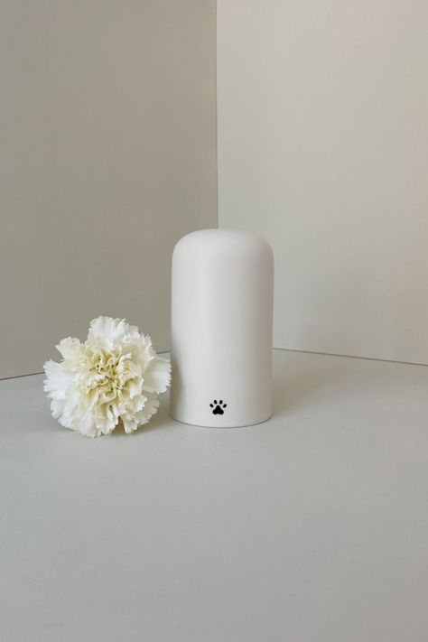 Our ORCHID pet urn in matte white porcelain and matte black paw Urn For Dog Ashes, Dog Urns, Cat Urns, Pet Urn, Pet Breeds, Modern Pet, Miniature Poodle, Pet Urns, Losing A Pet