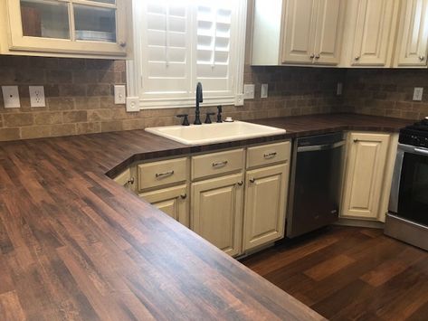 I just redid my kitchen countertops--Wilsonart Old Mill Oak Formica -- I love it!! Also replaced the sink with a single basin cast iron biscuit color purchased from Signature Hardware. Formica Wood Kitchen Countertops, Wood Laminate Bathroom Countertop, Wood Formica Countertops, Wilsonart Butcher Block Laminate, Wood Laminate Countertops Kitchen, Wood Grain Countertops Kitchen, Old Mill Oak Laminate Countertop, Wilsonart Old Mill Oak Countertops, Formica Wood Look Countertops