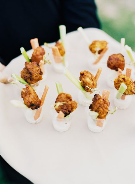 Hot wings and BBQ wings are another favorite, and if you don't want them fried, you can have them baked. Going boneless makes less of a mess, which guests, vendors, and your venue will appreciate. This wedding served tasty wings in cups with celery and carrots. Wedding Finger Foods, Maine Fall, Cocktail Hour Food, Boneless Wings, Fall Farm, Bbq Wings, Wedding Appetizers, Carnival Food, Wedding Cake Alternatives