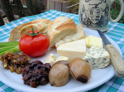 Just the words Ploughmans Lunch, conjures up images of lazy lunches sat outside with friends, in the Beer Garden of an old Country Pub! This is one of the most famous of pub lunches - so simple and yet so satisfying, especially if taken with a pint of real ale or cider!  Although the term Ploughman’s Lunch was first coined in the 1930’s, as part of a very successful marketing campaign, the concept behind it goes back much further. Throughout the centuries, agricultural workers would take the... Branston Pickle Recipe, English Salad, English Lunch, Cottage Loaf, Ploughman's Lunch, Branston Pickle, Lunch Photo, Ploughmans Lunch, Tustin California