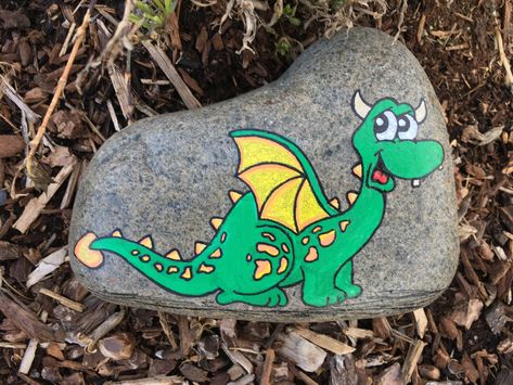 Rock Dragon Art, Dinosaur Rock Painting Ideas, Dinosaur Rocks Painting, Dinosaur Painted Rocks Ideas, Dragon Rock Painting, Dragon Painted Rocks, Painted Rocks Dinosaur, Dragons Painted On Rocks, Dragon Egg Painted Rocks