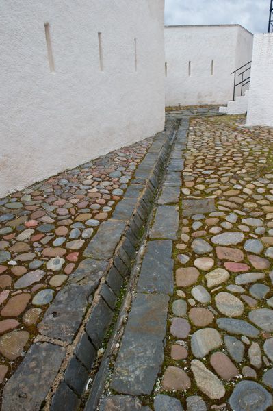 Drainage channel and cobbles Brick French Drain, Stone Drainage Channel, Open Drainage Pathways, Brick Drainage Channel, Chain Water Drain, Driveway Drain, Foundation Drainage, Coble Stone Walk Way, Drainage Channel