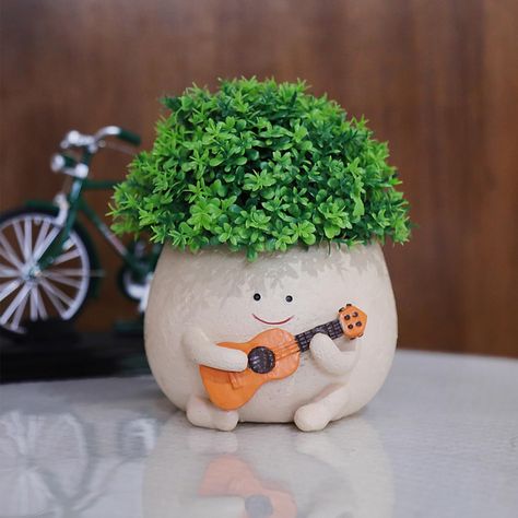 PRICES MAY VARY. Unique Guitar Planter: Smile face guitar head plant pot with durable resin material, suitable for any environment.Using this flowerpot will make the place you want to decorate more interesting. Funny Relaxed Pots: When you plant your favorite plants in our planter and it will look like a children playing guitar. It makes people feel happy and will eliminate worries in your life or work, will making you to relax feel. Cute Decor Planter: This is a smile face with guitar pot for p Guitar Planter, Face Pots, Funny Smiley, Funny Guitar, Face Planters, Small Potted Plants, Children Playing, Vase Shapes, Feel Happy