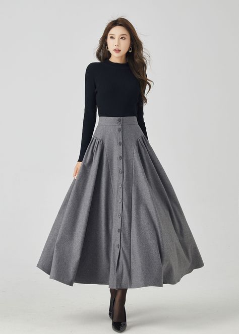 "The gray wool skirt made with soft wool blend, it has a polyester lining inner. It is high waist skirt for winter day,  The long vintage skirt has no pockets because of the special waist.  we created many women skirt with different style , we like some pleated skirt with longer and bigger hem style, it won't show my hips bigger, make me more elegant. DETAILS * 30% wool blend, 40% fiber and polyester, 40% nylon * Full polyester lining * Front buttons closure * No Pockets, can't add for the style * Ankle length * Dry clean MODEL SIZE Bust 85 cm(33.4\") Waist 67 cm(26.7\") Height 168cm (5' 6\") She wears size XS Choose CUSTOM Order if you * Need other color * Can't find your size in our size Chart * Chang the Length * Your Height is not Between 5'1\" - 5\"9\" * Your weight is not from 47kg t Edwardian Skirt Pattern, Victorian Skirts, Long Vintage Skirt, Winter Wool Skirt, Skirt For Winter, Skirts Patterns, Edwardian Skirt, Wool Maxi Skirt, Long Wool Skirt