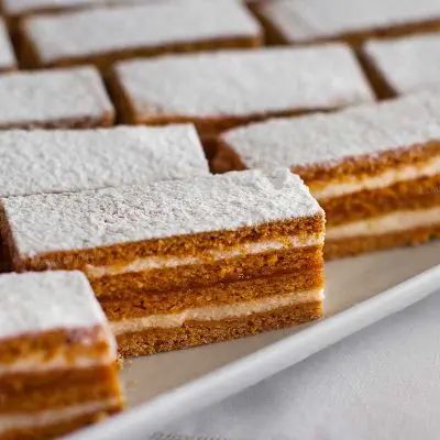 Romanian Albinita (Honey Cake With Plum Jam & Cream Filling) - Chef's Pencil Cake Preparation, Romanian Desserts, Semolina Cake, Cake Recepies, Baking With Honey, Cake Baking Recipes, Romanian Food, Honey Cake, Sweet Cakes