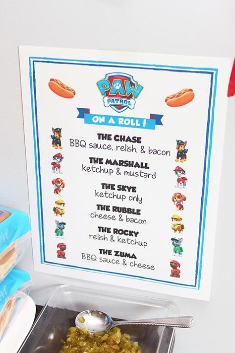 Planning a Paw Patrol birthday party for your little hero? This pawsome guide has everything you need for decorations, invitations, food ideas, fun activities, and adorable favors - perfect for boys or girls! Don't forget the Paw Patrol cupcakes! Get ready to throw an unforgettable Adventure Bay birthday! Paw Patrol Menu Food Ideas, Paw Patrol Hot Dog Bar, Hot Dog Bar Menu, Paw Patrol Party Food, Paw Patrol Party Games, Paw Patrol Party Favors, 3rd Birthday Party For Boy, Paw Patrol Party Decorations, Paw Patrol Cookies