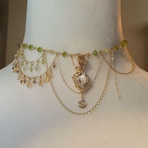 Victoria on Instagram: "✨Hey everyone!! Just checking in while I’m finishing up a special collection to send to @ariisacat for my FIRST EVER fairy choker photoshoot(!!!!)🥹❤️‍🔥 This is a work in progress shot of a peridot, white moonstone, and Ethiopian opal on 14k gold filled Tinkerbell inspired choker (thank you to @kailifornia_ for inspiring me to do this when I posted these peridot beads a couple months ago!!) I wanted my first fairy choker photoshoot to feature pieces that resonate the most with the creative vision that drives the Soul Society. Working on these pieces with these sweet pastel color palettes has without question been keeping my mind in a state of never ending spring!! I keep walking outside and thinking “omg what a beautiful spring day”…🫠So I decided it would be fitti Renfaire Outfits, Couples Jewelry Necklaces, Fairy Choker, Diy Jewelry Videos, Elf Jewelry, Walking Outside, Ethereal Jewelry, Soul Society, Elf Dress