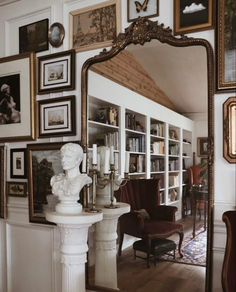 Romantic Academia Interior, Modern Home Vintage Decor, White Walls Apartment Decorating, Victorian Inspired Apartment, Vintage Dark Academia Home Decor, Ornate Picture Frames On The Wall, French Home Library, Cottagecore Study Room, Mirror Above Window