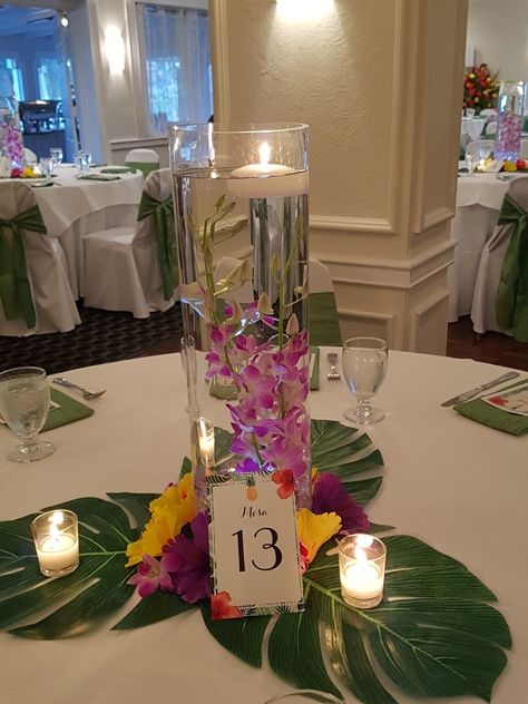 Tropical Floating Candle Centerpiece, Hawaiian Flower Arrangements For Tables, Luau Party Center Piece Ideas, Aloha Centerpieces Hawaiian Luau, Tropical Rehearsal Dinner Decorations, Hawaiian Theme Quinceanera, Caribbean Centerpiece Ideas, Wedding Tropical Centerpieces, Diy Tropical Centerpieces Wedding