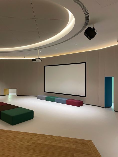 A dynamically lit home theatre in Beijing features a colourful constellation of Kvadrat textiles. The space, created by Peng Wenhui in collaboration with acoustic designer Qiao Zhenyu, embodies two complementary approaches: "design for seeing" and "design for hearing."

The acoustically optimised space is built on an oval-shaped floor plan. It integrates a curved inner wall within a curved outer wall divided by a passage. Selected wall panels on the walls are upholstered in Revive 1. Upholstered Wall Panels, Home Theatre, Wall Panels, Home Theater, Beijing, Floor Plan, Floor Plans, Textiles, Wall