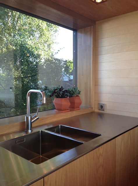 Love the smooth lines, and large window in this kitchen space! - Scandinavian Retreat: A few more snaps from our kitchen Double Sink Kitchen Stainless Steel, Stainless Steel Kitchen Bench, Window Over Sink Kitchen, Stainless Steel Worktop, Kitchen With Window Over Sink, Large Kitchen Window Over Sink, Big Kitchen Sink, Double Sink Kitchen, Window Over Kitchen Sink